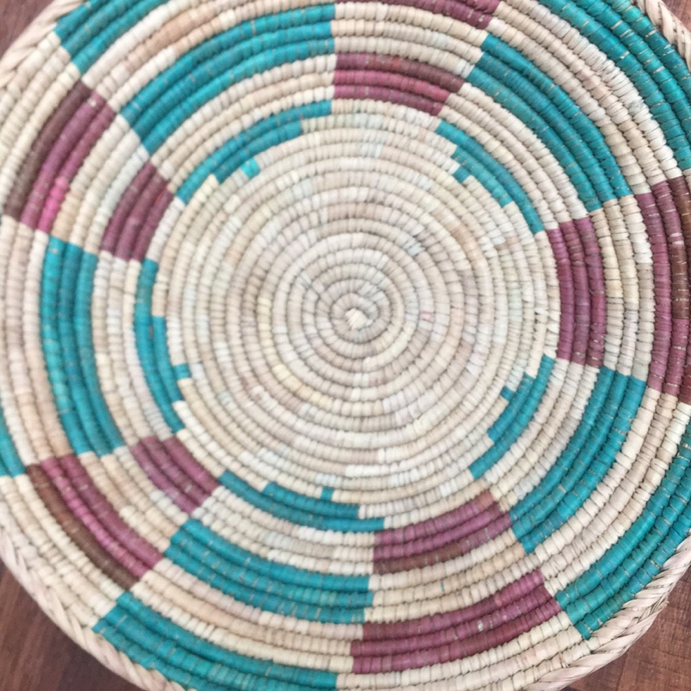 Southwest style boho coil woven wall basket.